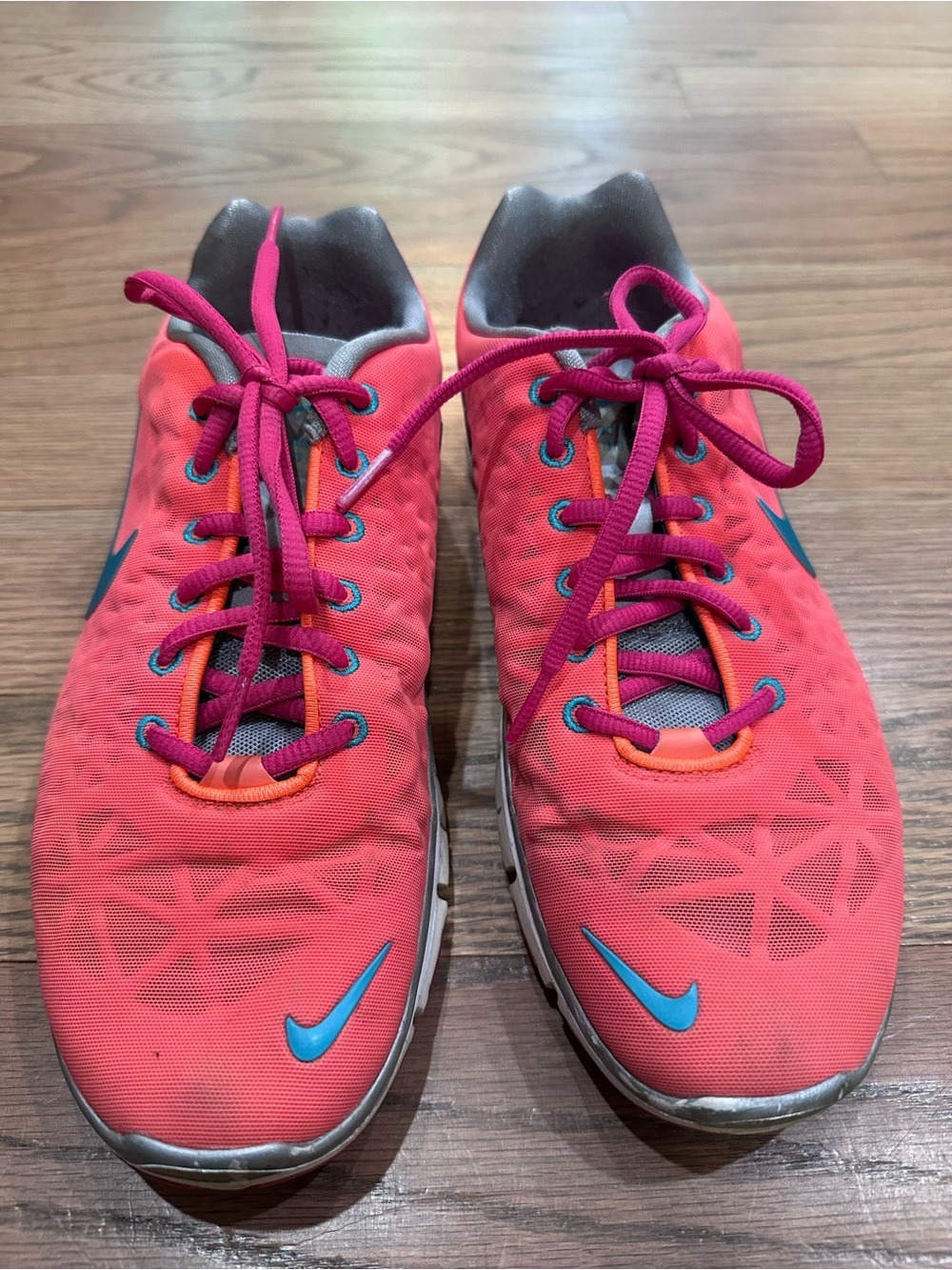 Nike Coral Pink and Orange Women's Running Shoes with Blue Swoosh